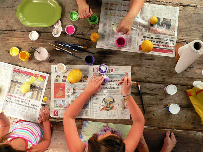 kids making paper mache lemons - the benefits of crafting include creativity