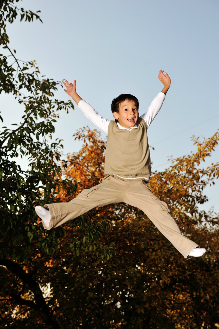 child exuberantly jumping