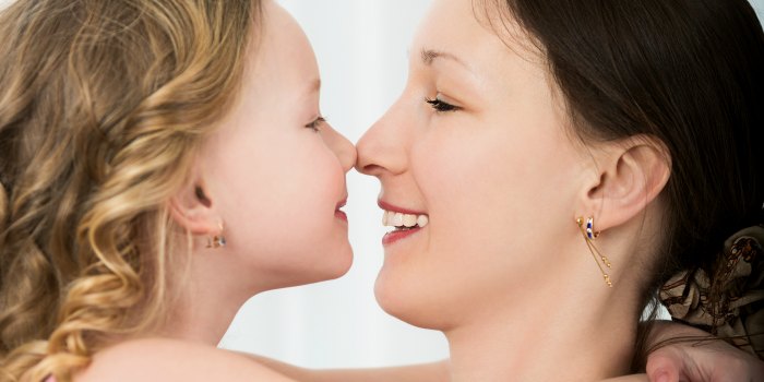 mom and daughter touching noses