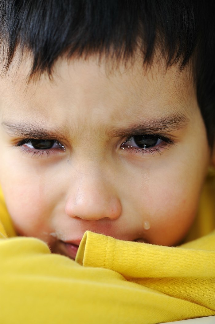 close up of boy crying