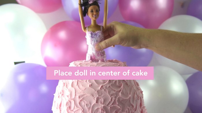 place doll in center of cake