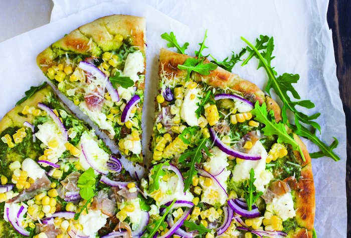 grilled pizza chock full of pesto, corn, red onion