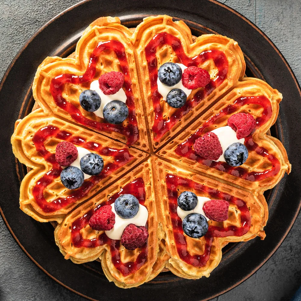 These authentic Swedish waffles bring a light, crispy texture and a traditional taste that's perfect for any breakfast or snack. Decorate like this for 4th of July breakfast.