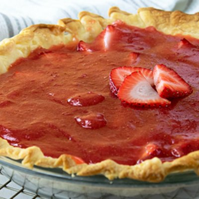 close of up a cooling strawberry pie - chock full of strawberries!