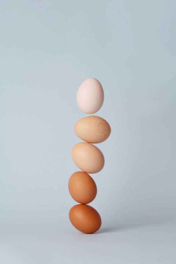 different colored eggs stacked