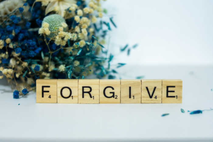 forgive spelled in scrabble wood tiles - Teaching Children Forgiveness