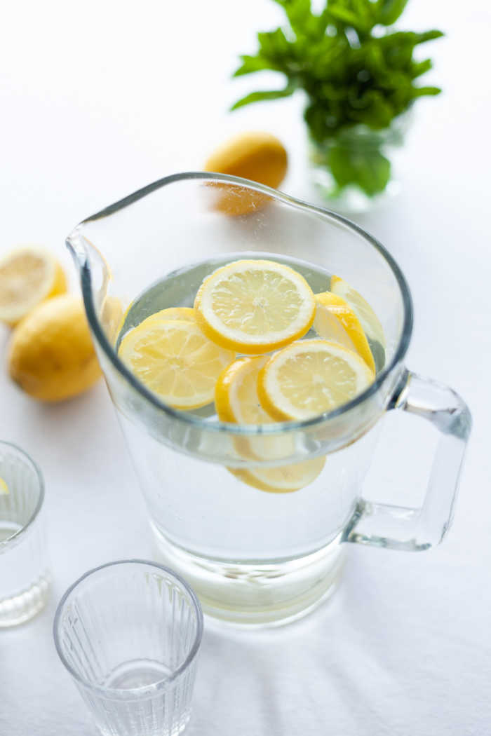 pitcher of water with lemons