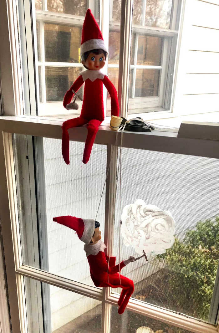 Elf on the Shelf Window Washing - getting the place ready for Santa!