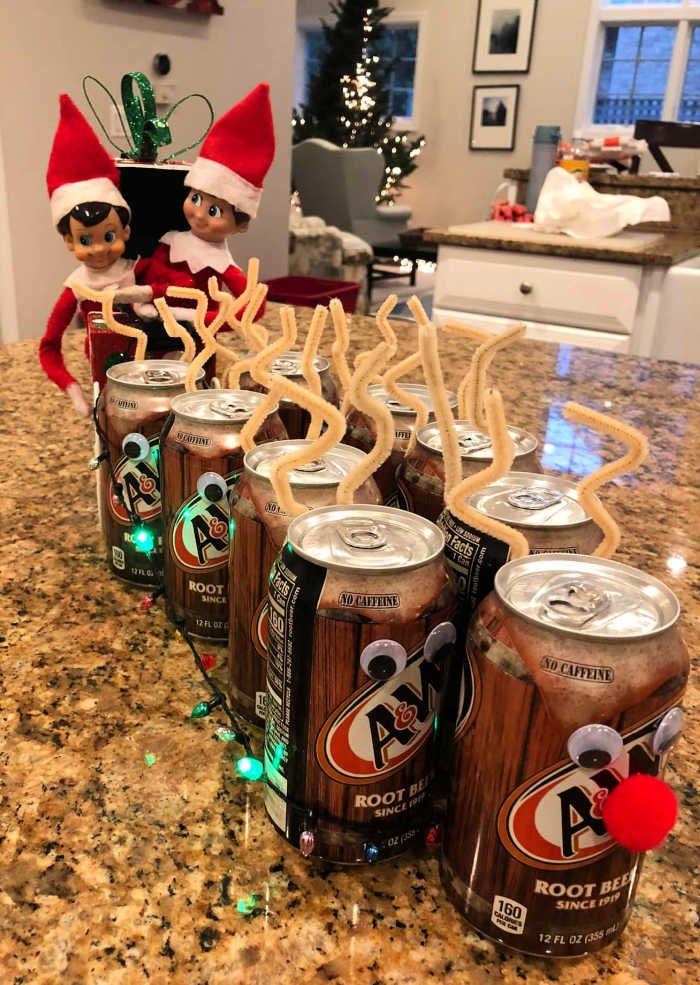 Elf on the Shelf takes a sleigh ride with soda cans