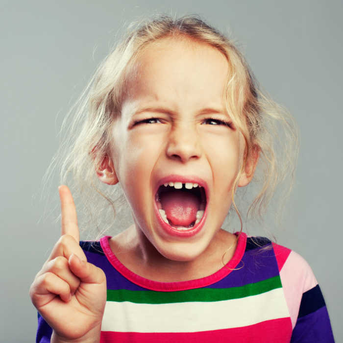girl yelling with finger pointed upward