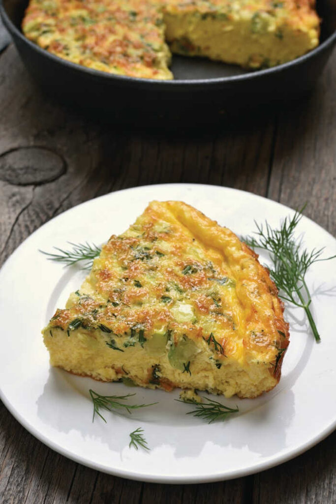 Indulge in the savory delights of a Herbed Spanish Omelet, a flavorful fusion of potatoes, spring herbs and red onions. 