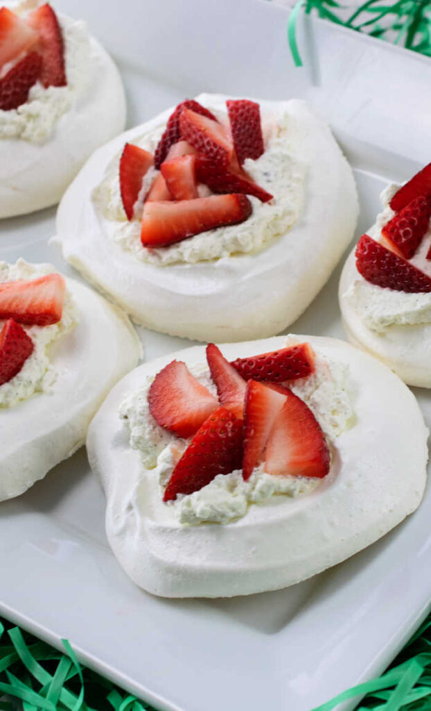 These Easy Easter Meringue Nests with Vanilla Bean Whipped Cream and Strawberries are the perfect Spring addition to your Easter gathering.