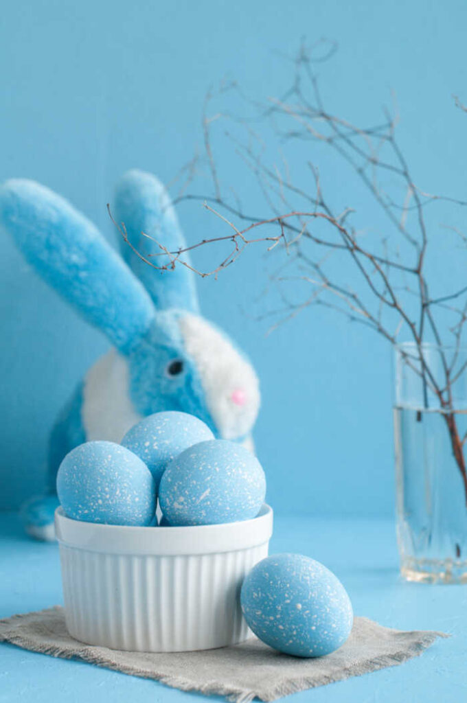 blue easter eggs in a bowl with  for beautiful easter table decoration ideas