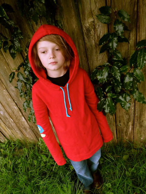 child in red hooded sweatshirt