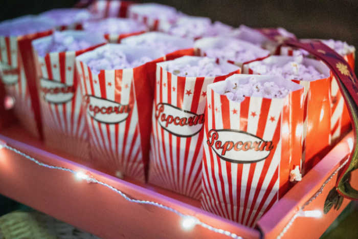 popcorns in red and white striped bags