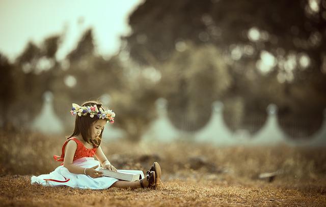 little asian girl with flowers reading