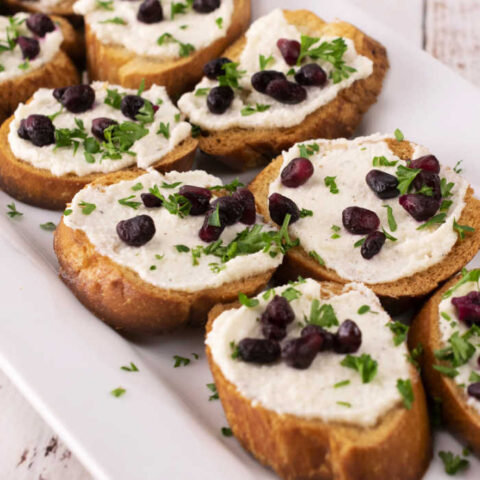 Easy Crostini Appetizer with Roasted Garlic and Whipped Feta
