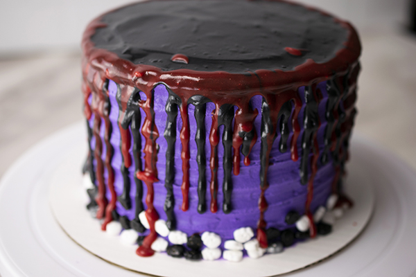 cake drip covered in red and black icing