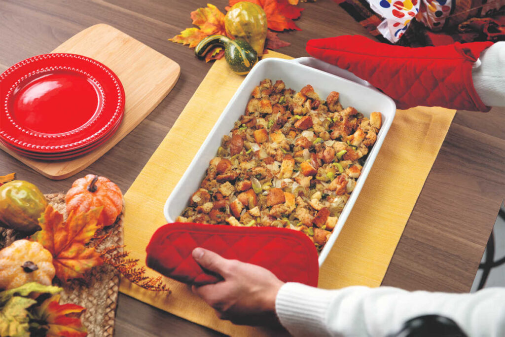 Thanksgiving stuffing being served in casserole dish