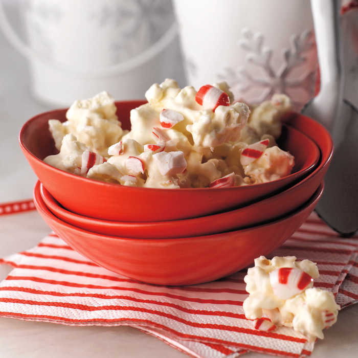 white chocolate peppermint popcorn in holiday red bowl