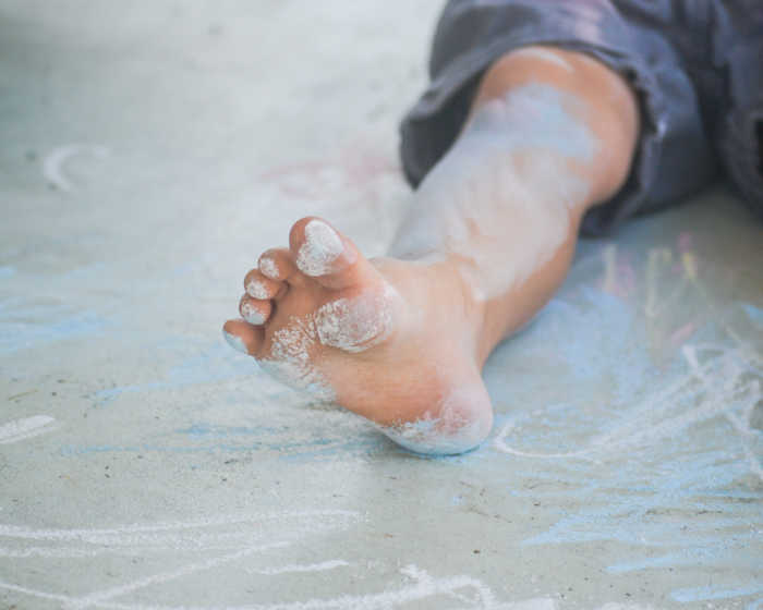 child sensory play with chalk - chalk on feet