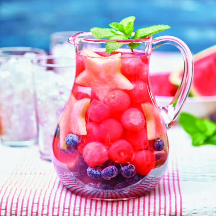 watermelon infused water in a glass pitcher