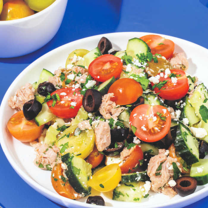 mediterranean tuna salad with feta, cherry tomatoes, cucumber and olives