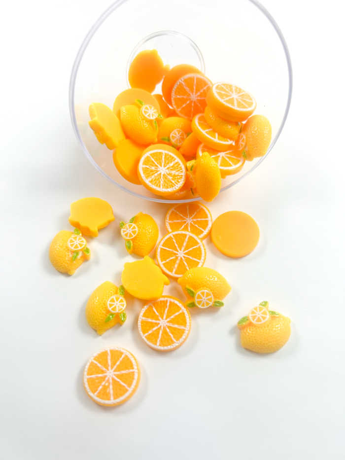 lemon buttons with orange slices used for sensory bottle