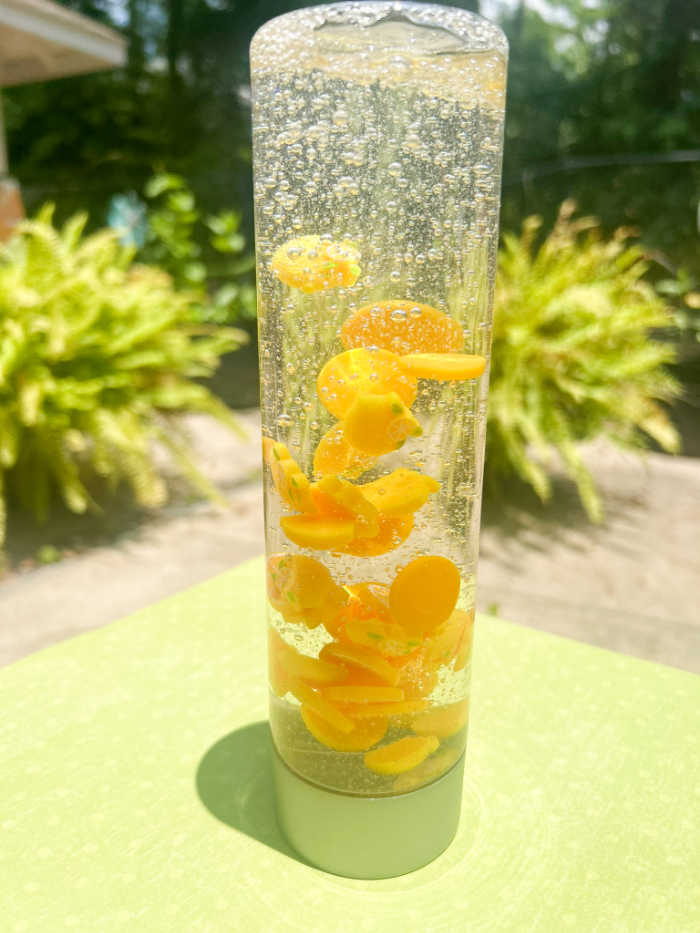 Delightful lemon sensory bottle captures the essence of zesty lemons and offers a multisensory experience that invigorates the senses and brings a burst of citrusy joy.