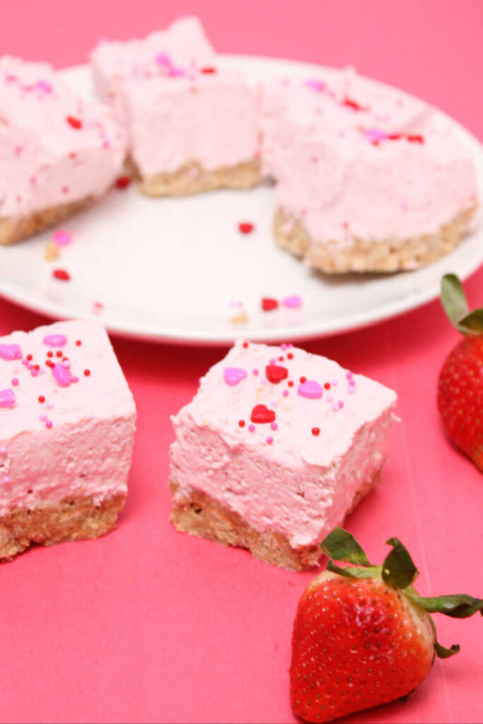 Get ready to tantalize your taste buds with our delectable No Bake Strawberry Cheesecake Bars!  Picture a luscious layer of creamy cheesecake filling infused with the natural sweetness of ripe strawberries, all cradled atop a buttery graham cracker crust.