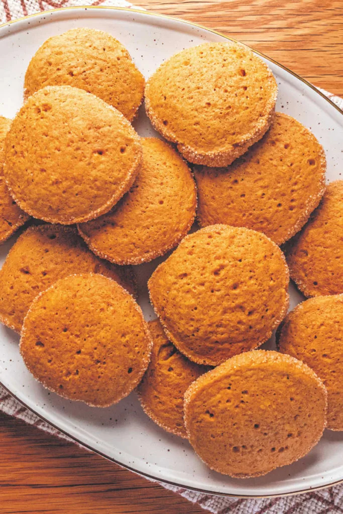 These Pumpkin Spice Cookies are soft and flavorful, made with browned butter, real pumpkin, and warm spices, then rolled in a cinnamon-sugar coating for a cozy fall finish.