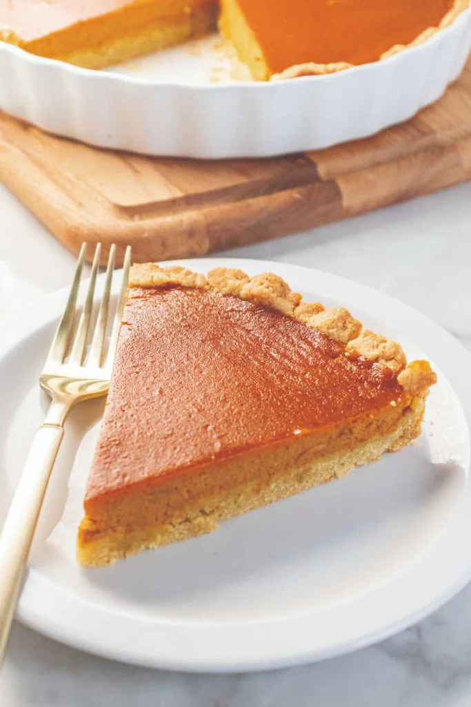 This Easy Pumpkin Pie features a smooth, spiced pumpkin filling baked in a flaky pie crust, delivering a classic, comforting dessert perfect for any holiday table.