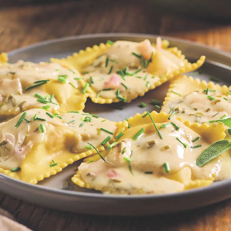 This rich, savory-sweet pumpkin ravioli pairs beautifully with sides and drinks that enhance its fall flavors and creamy sauce.