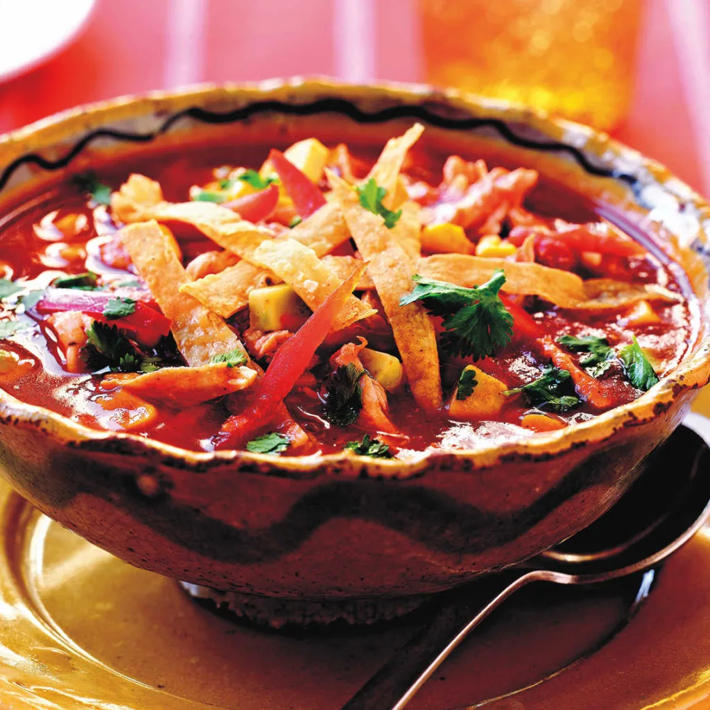 Slow Cooker Chicken Tortilla Soup is complete with bold flavors.