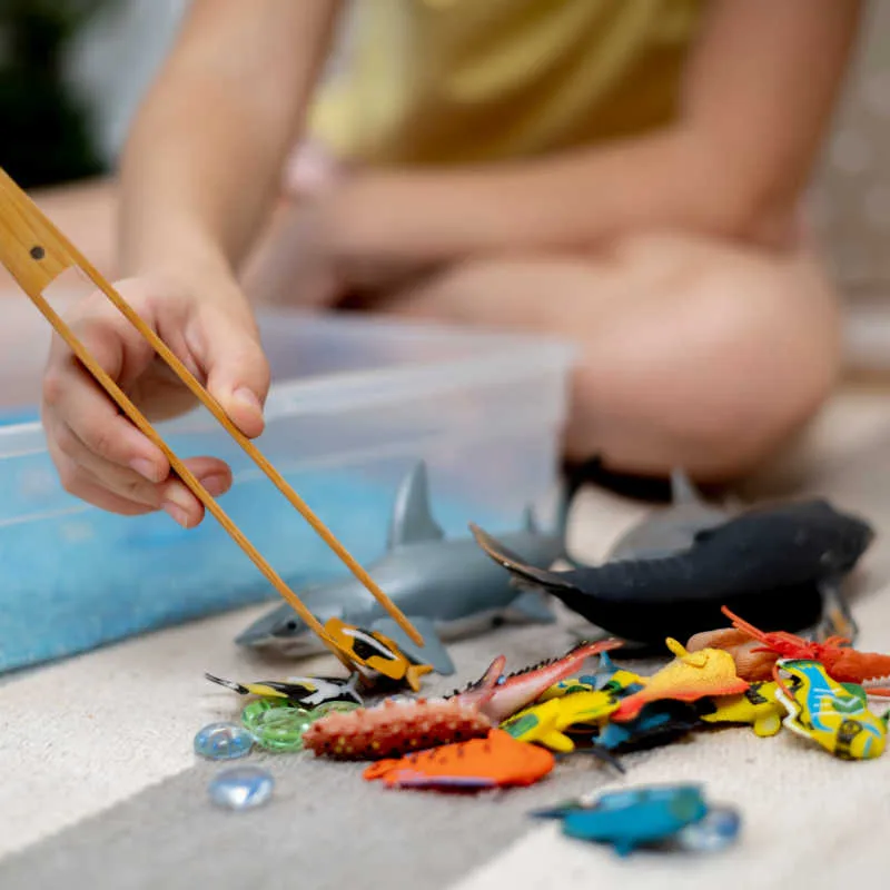Extend the Ocean Animal Sensory Bin while supporting sensory exploration, fine motor development, early science concepts and imaginative play.