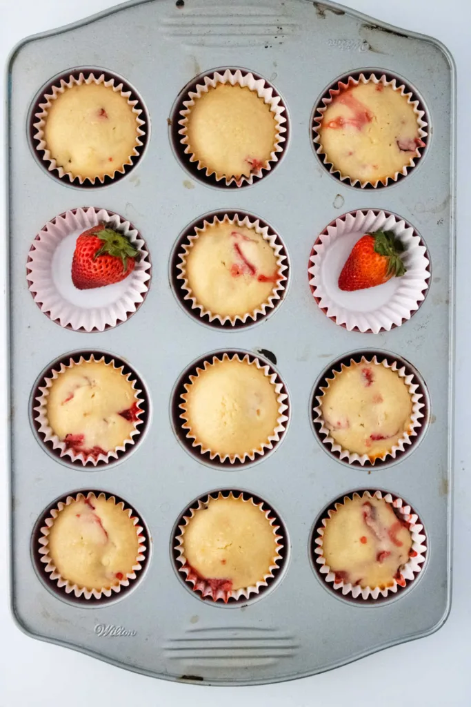Strawberry Muffins deliver a soft, tender crumb with juicy pieces of fresh strawberries in every bite.