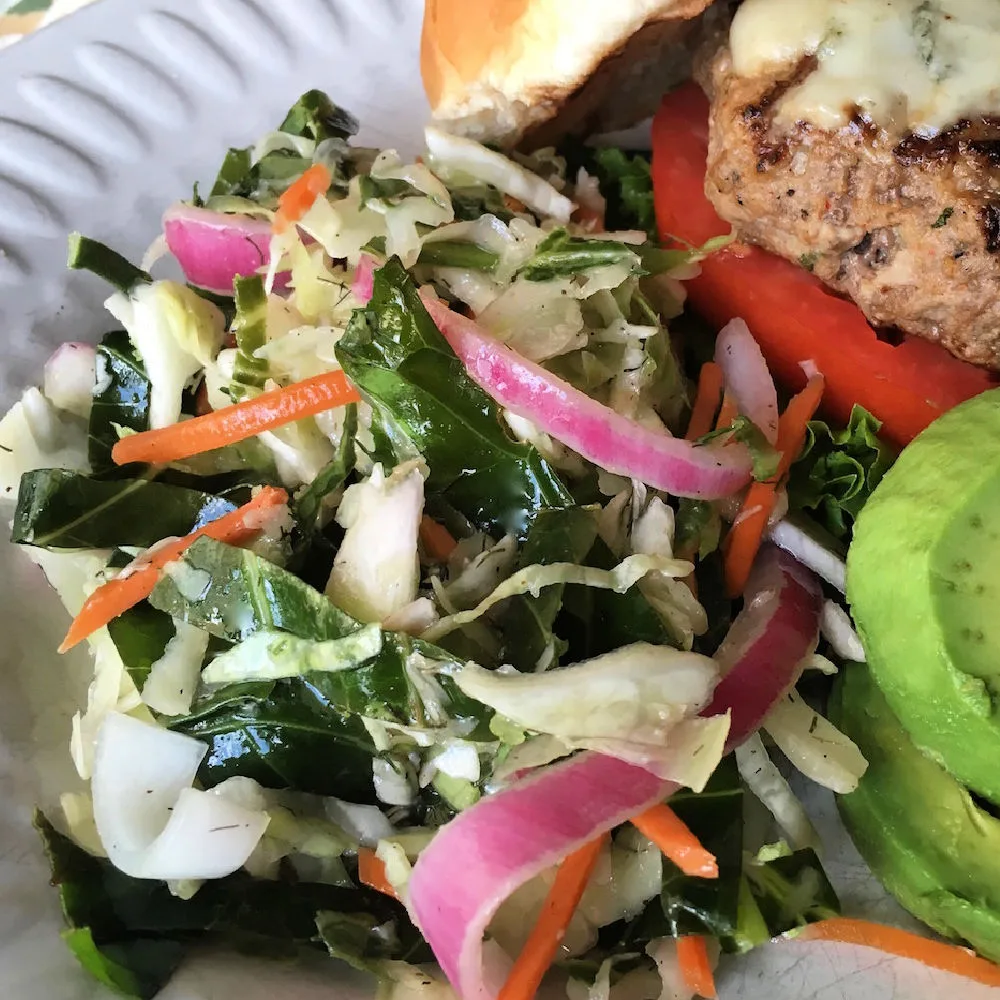 North Carolina coleslaw is a vinegar-based coleslaw that’s tangy, slightly sweet, and crisp, rather than creamy.