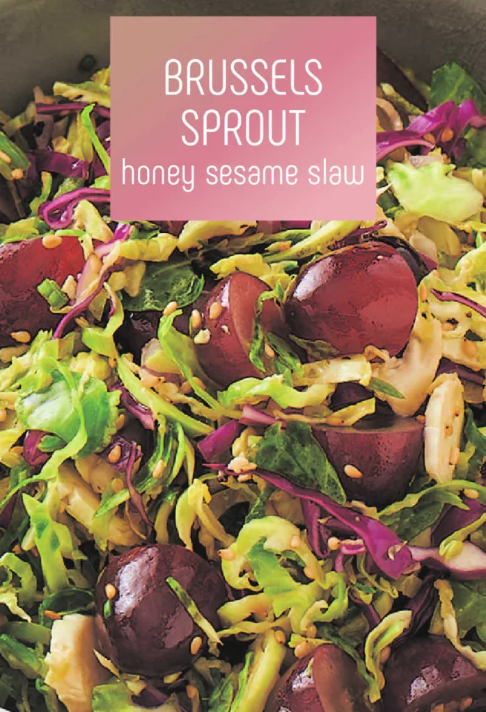 This honey sesame Brussels Sprout Slaw blends shredded Brussels sprouts and red cabbage with sweet red grapes, crisp scallions and a tangy-sesame dressing for a fresh, flavorful side dish that’s perfect for any meal or gathering. 
