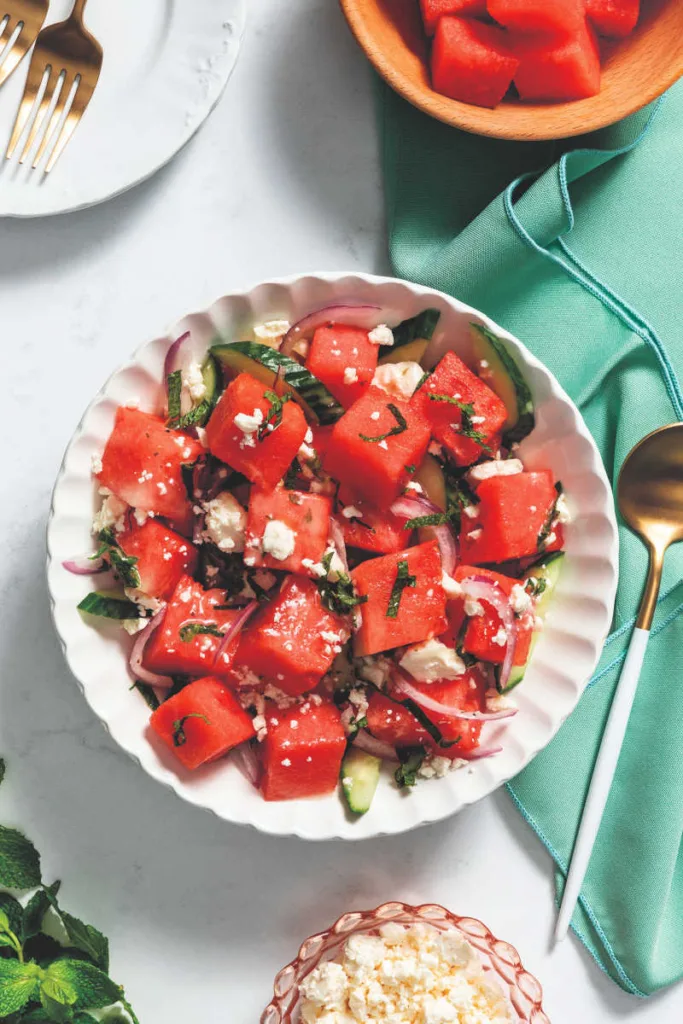 This Best Watermelon Salad combines sweet, juicy watermelon with crisp cucumber, tangy feta, and fresh mint, tossed in a zesty lemon vinaigrette for a refreshing, vibrant side.