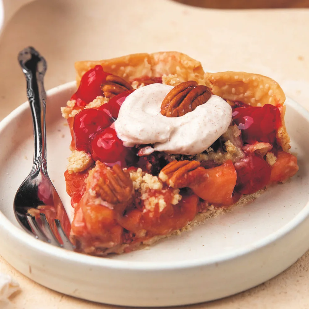 Cherry Apple Pie layers cherry and apple filling into a flaky crust, tops with streusel and bakes until golden and abubbling.