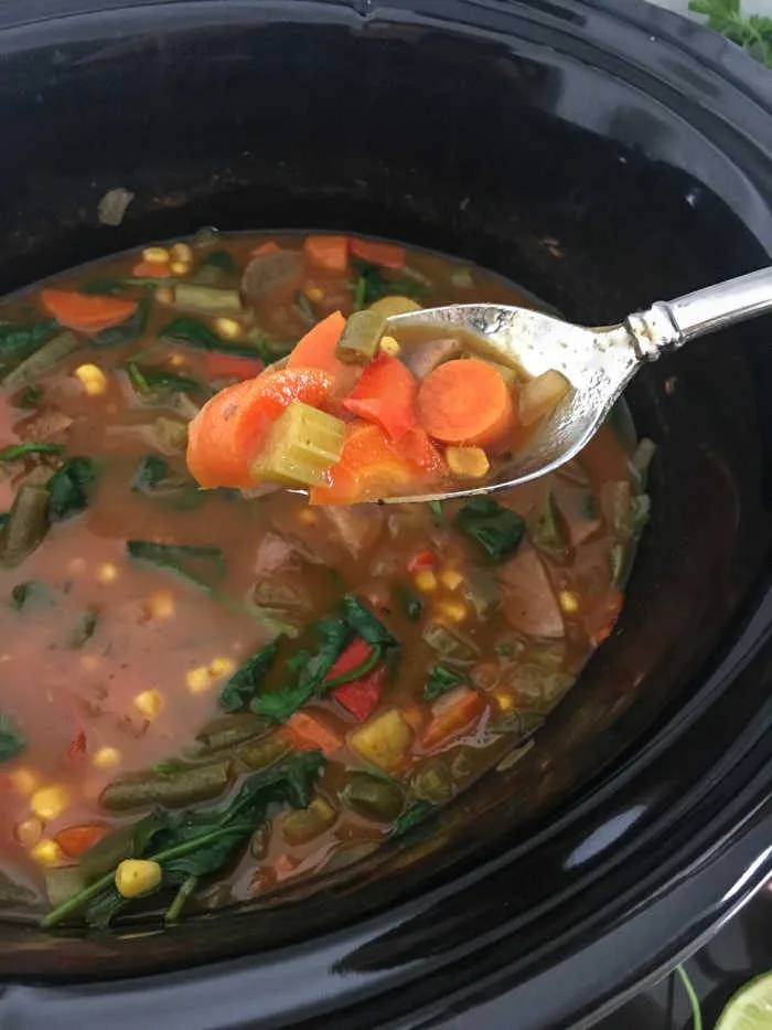 Slow Cooker Vegetable Soup slowly simmers fresh vegetables in a seasoned tomato broth, then finishes with spinach and lime juice for a bright, comforting bowl.